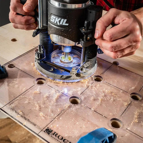 Hands using Spaced Dog Hole Router Template For Precise Holes And Bench Tools Like Dogs Cookies And Holdfasts Non Slip Easy To Align Inlay Jig For Woodworking Projects A Must-Have Tool For Quick Clean Accurate Grids on a workbench