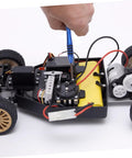 Hand using RC Car Repair Tool Kit With Wrench, Screw And Fastener Set on car chassis