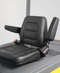 Close-up of the black seat with armrests for the 4 Wheel Electric Forklift Truck With 6600 Lb Capacity, Built Tough For The Daily Grind.