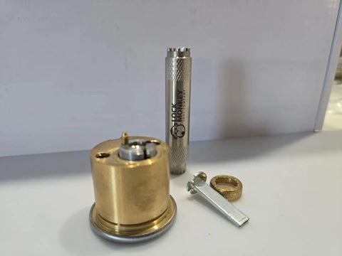 Hollow Stainless Steel Lock Cylinder Cap Removal Tool for easy disassembly and rekeying of locks, shown with various lock components.