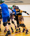 Women on quad skates in a rink wearing Lickety Splits Roller Skate Bearings 16 Pack For Quad Skates ABEC 9 Pre Lubed.