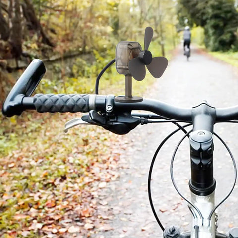 Portable Wind Turbine Generator For Camping And Hiking Mini Wind Power Charger attached to bike handlebars.