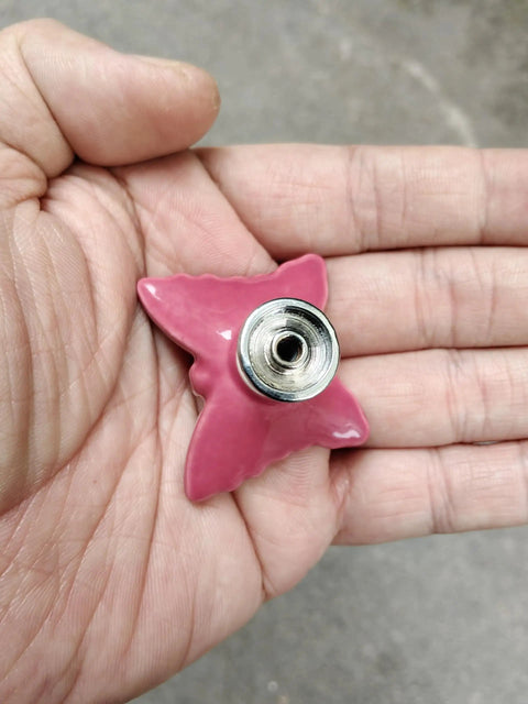 Hand holding Ceramic Butterfly Cabinet Knob from Pink 6 Pack, Vintage Drawer Pulls for Dresser, Wardrobe, Cupboard, and Kitchen Cabinets