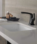 Sleek Matte Black Vesna Bathroom Faucet With Drain Kit Included Fits Single Hole Or Three Hole Four Inch Configurations on countertop