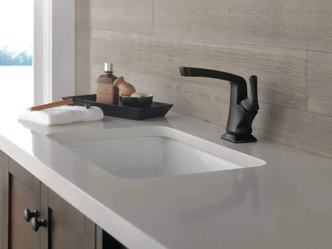 Sleek Matte Black Vesna Bathroom Faucet With Drain Kit Included Fits Single Hole Or Three Hole Four Inch Configurations on countertop