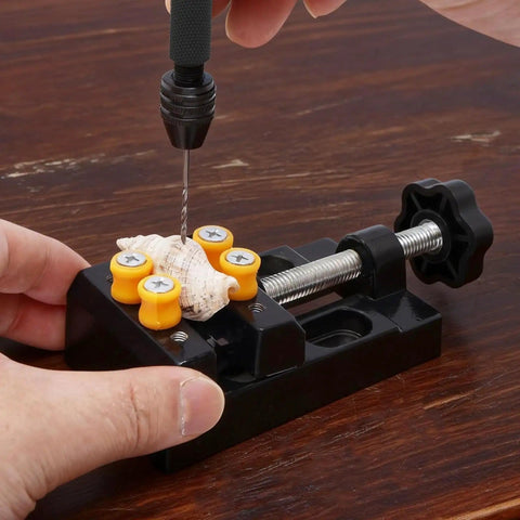 Mini Drill Press Vise Kit With 0 To 2.17 Inch Clamping Range holding shell for precise drilling on table