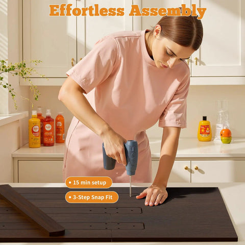 Person assembling 54 Inch By 27.5 Inch Wood Laundry Countertop Topper For Washer And Dryer on counter in kitchen.