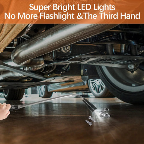 Hand using extendable magnetic flashlight tool to pick up screws under car.