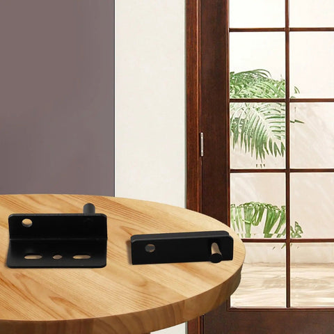 Pair Of Heavy Duty Iron Hinges With Bushings And Protective Plastic Caps Perfect For Wooden Doors Kitchen Cabinets And Furniture on a wooden table.