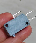 Fits For Honeywell Microswitch V15T16C1Z200 high current 16A 250V limit travel switch, gray and compact, held in hand.