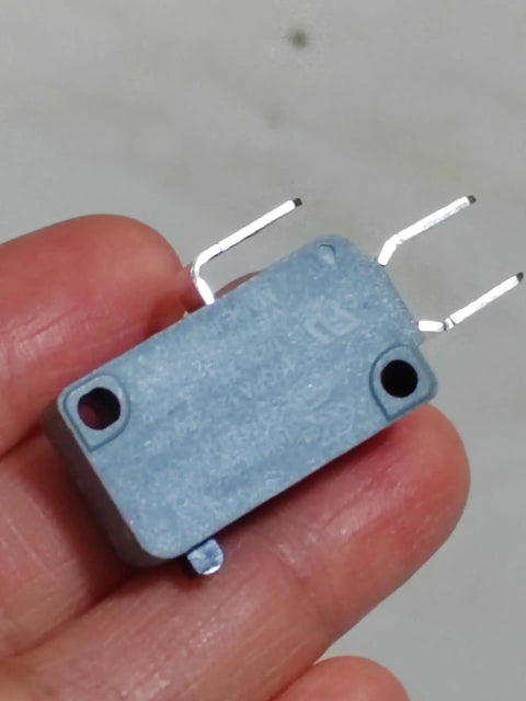 Fits For Honeywell Microswitch V15T16C1Z200 high current 16A 250V limit travel switch, gray and compact, held in hand.