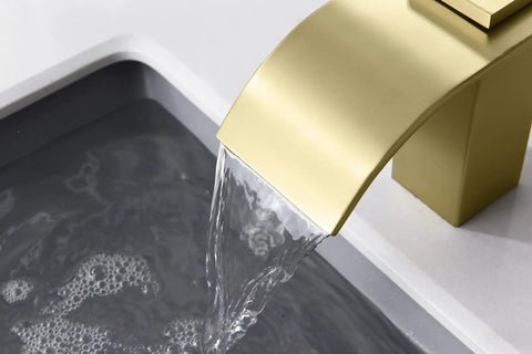 Brushed Gold Waterfall Bathroom Faucet, 8-Inch Widespread 3-Hole Sink Faucet, Solid Brass Valve, water flowing into a sink
