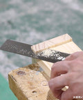 Top Tier Japanese Flush Cutting Hand Saw For Fine Woodworking Trimming Dowels Tenons And Tight Quarters Ultra Slim Blade cutting wood with precise detail.