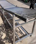 Heavy Duty Adjustable Height Roller Stands Rock Solid Conveyor Support Legs For Table Saws And Woodworking Shops showing stainless steel construction.