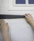 Person installing Heavy Duty Soft Close Magnetic Hardware Kit Six Piece Set With Rock Solid Steel Construction above a cabinet door.