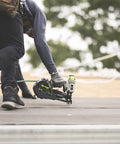 Durable Badass Pneumatic Cap Nailer Built Like Steel For Smashing Roofing Underlayment Sheets With Huge Capacity Magazine and Smooth Bump Fire Trigger Action in use on roof.