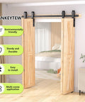 52 Inch Bifold Barn Door Hardware Kit For 4 Bifold Doors Black Finish shown installed in bedroom entryway