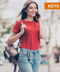 Woman using phone with keys attached to Beefy 12kN Heavy Duty Carabiner Clips With Ultralight Screw Lock Locking Design for Keychains