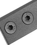 Close-up view of a black metal bracket with screws from the Sturdy Black Sliding Barn Door Hardware Connector Set With Metal Track And Replacement Bracket For Easy No Fuss Installation And Strong Secure Fit In Any Modern Home Or Workshop.