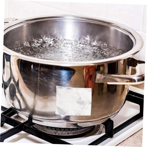 Stainless steel pot with Heavy Duty High Temperature Leak Stop Tape For Home Plumbers Multi Purpose Seal Strip Ideal For Radiators Pots Buckets Aluminum Repair Oilproof And Tear Resistant Waterproof Water Leak Sealing Tape applied on side, placed on stove with boiling water