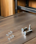 50 Pcs Premium M5 Cross Dowel Nuts Silver Carbon Steel Barrel Nut Connector Hardware on wooden surface for assembly projects.