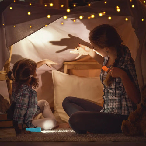 Mother and child play with 10 Pack Nine LED Mini Flashlights With AAA Batteries Included And Pre Installed Ideal For Class Teaching Camping Or Wedding Favors And Everyday Use Compact And Durable For Easy Everyday Carry in a cozy fort