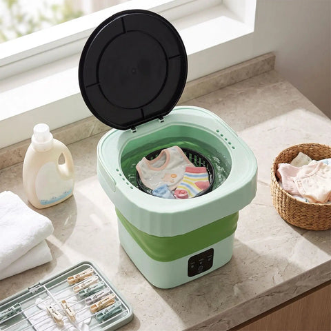 Laundry Day No Sweat With This 6L Folding Portable Washing Machine filled with children's clothes on a kitchen countertop.