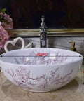 Top Shelf Above Counter Vessel Sink For Modern Bathroom Vanity High Gloss Art Porcelain Wash Basin Built Tough Ceramic Craftsmanship And No Sweat Install 40X15 Cm Slick Finish with floral design on a countertop.