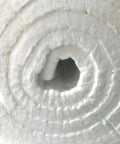 Close-up of rolled 31 By 24 By 1 Inch Ceramic Fiber Blanket Insulation 6 Pound 2300F Continuous Use Temperature for wood stoves and more.