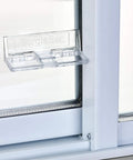 Sliding Door Security Bar, Hinge Style Lock For Patio Doors And Windows installed on a glass door, clear design