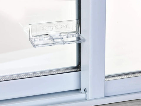 Sliding Door Security Bar, Hinge Style Lock For Patio Doors And Windows installed on a glass door, clear design