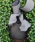 Solid Brass Door Viewer Peephole With 220 Degree View And Privacy Cover on a decorated door with greenery and striped ribbon
