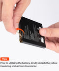 Hands removing yellow insulating sticker from a battery, highlighting preparation step before using the battery.