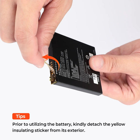 Hands removing yellow insulating sticker from battery before use, instruction for proper installation in device