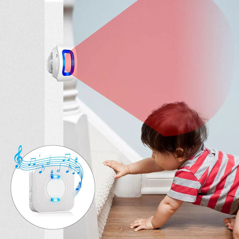 Child near wireless motion sensor LED light alarm with 500 ft range and loud chimes, 58 ringtones, 5 volume levels.