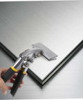 Manual Metal Bender Tool With Straight Jaw, Hand Seamer being used on metal sheet for bending, ideal for tight spaces.