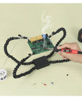 Pro Grade Flexible Third Hand Soldering Station with arms in use for soldering PCB on workbench.