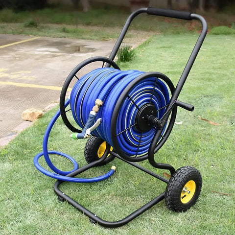 Heavy Duty Garden Hose Reel And Portable Hand Push Hose Cart With Inflatable Wheels, blue hose mounted, on grass.