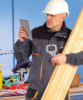 Man in safety helmet using Super Heavy Duty C Clamps With Quick Flat Head Lock For Welding And Woodworking Projects, holding wood.