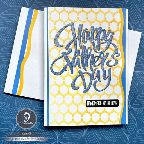 Father's Day card with yellow honeycomb pattern, blue foil 'Happy Father's Day' text, handmade label, matching envelope visible.