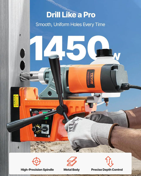VEVOR magnetic drill press with orange body and black handle mounted on a steel work surface