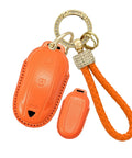 Premium Genuine Leather Key Fob Cover For Tesla Model X in vibrant orange with heavy-duty keychain for added protection.