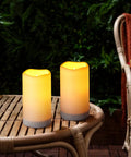Solar Flameless Candles Outdoor Waterproof Led Lantern Lights on bamboo table in garden