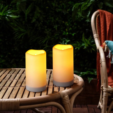 Solar Flameless Candles Outdoor Waterproof Led Lantern Lights on bamboo table in garden