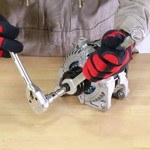 Person using 13 Piece Alternator Pulley Tool Set for Easy Decoupler Removal and Install on alternator unit