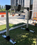 Built Damn Tough Portable Gantry Crane 1 Ton Capacity Adjustable Height Heavy Steel Hoist on lawn with smooth rolling wheels.