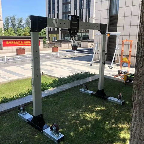 Built Damn Tough Portable Gantry Crane 1 Ton Capacity Adjustable Height Heavy Steel Hoist on lawn with smooth rolling wheels.