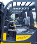 Interior view of Heavy Duty Rough Terrain Forklift Truck Powered By Clean Electric Motor with multiple operator seats and controls.
