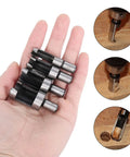 Top Shelf Carbon Steel Wood Plug Cutter Set With Taper Claw Bits And Chamfered Edge Cutters In 5/8 1/2 3/8 1/4 Inch Sizes held in hand.