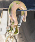 5/16 Chain Hook With Safety Latch Heavy Duty Clevis Slip Hook Grade 70 Forged Steel 14,000 Lbs Capacity Ideal For Towing, Rigging, And Industrial Construction Projects. close-up on chain hook with safety latch attached to chain